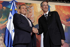 Honduran President Porfirio Lobo shaking hands with Guatemalan President Álvaro Colom at a meeting on May 13.